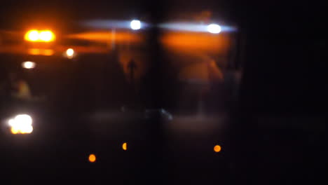 slow motion racking focus on a roadworks van at night