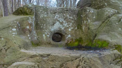 an ancient dolmen from a large megalith with a platform in front of the entrance.