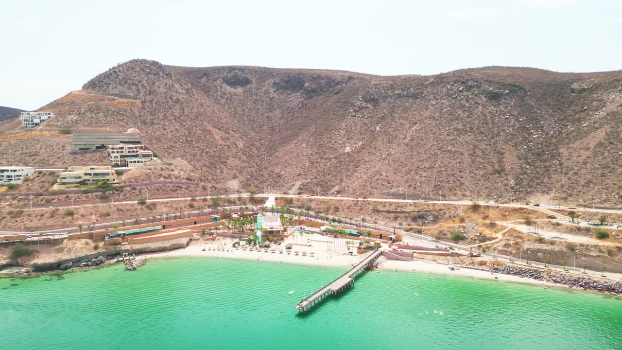 Playa coromuel, pier and turquoise sea in la paz, baja california sur, aerial view