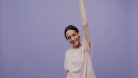 teenage girl smiling and reaching