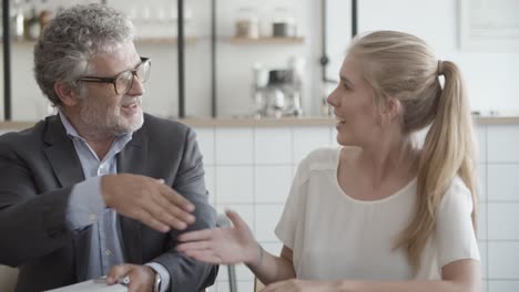 happy partners signing contract, handshaking and enjoying