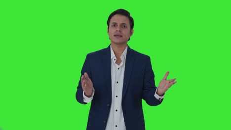 Indian-journalist-reading-news-to-audience-Green-screen