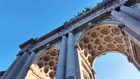 low-angle shot of cinquantenaire arch with ornate ceiling details