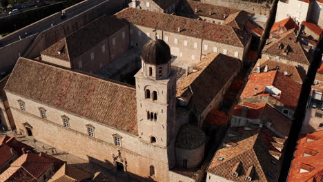 bell tower of franciscan church and monastery in dubrovnik, croatia on a sunny afternoon