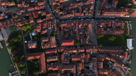topdown view of houses in burano island at the venetian lagoon in venice, italy. - aerial shot