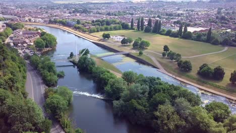 flying over the beautiful river exe in exeter, england, with cityscape background