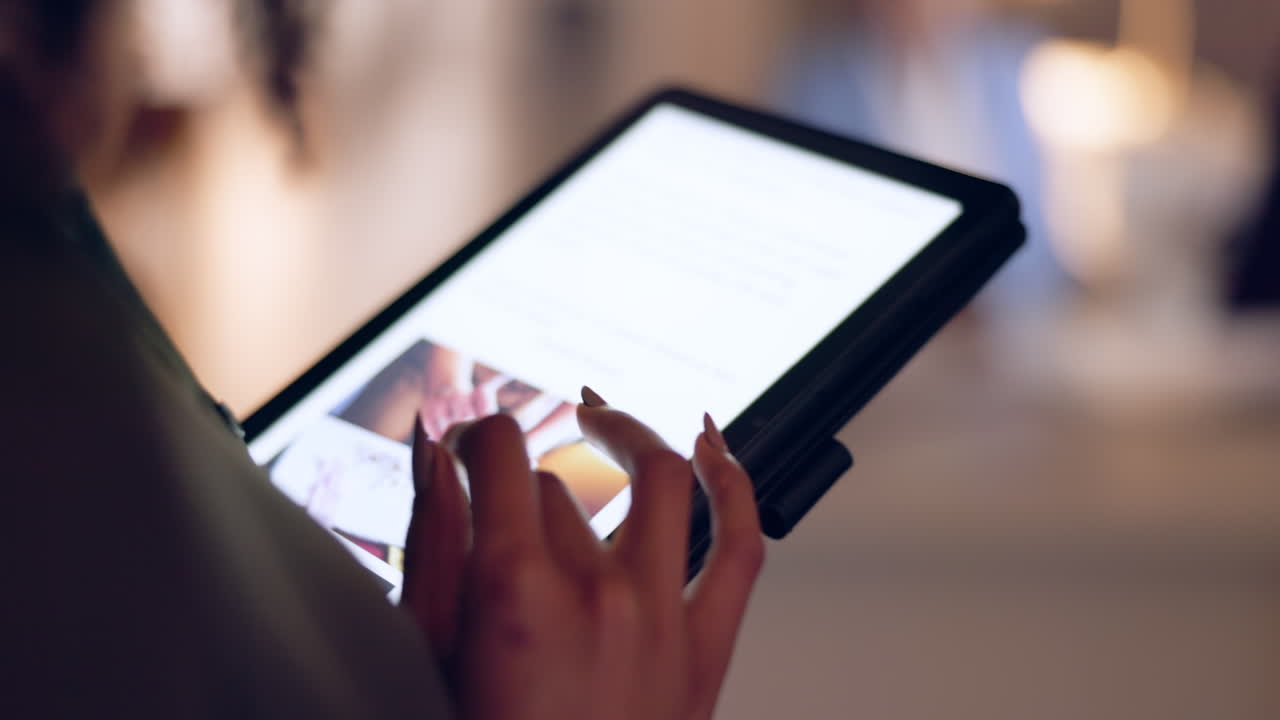 Woman using tablet for online shopping or browsing products.