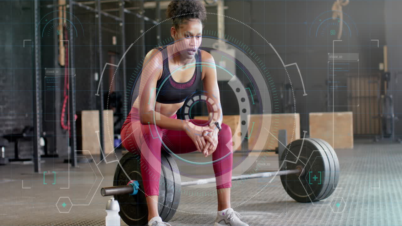 Animation of scanner processing data over biracial woman sitting on barbells after training at gym