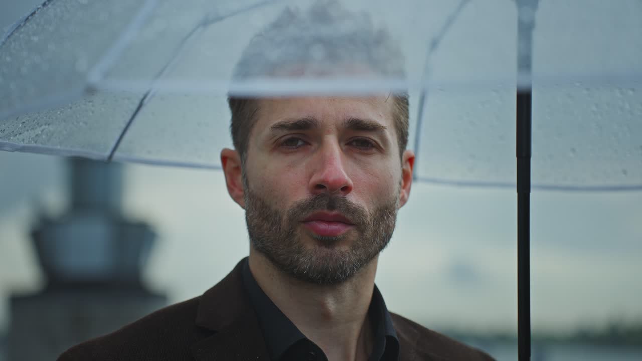 Man Under Umbrella in the Rain