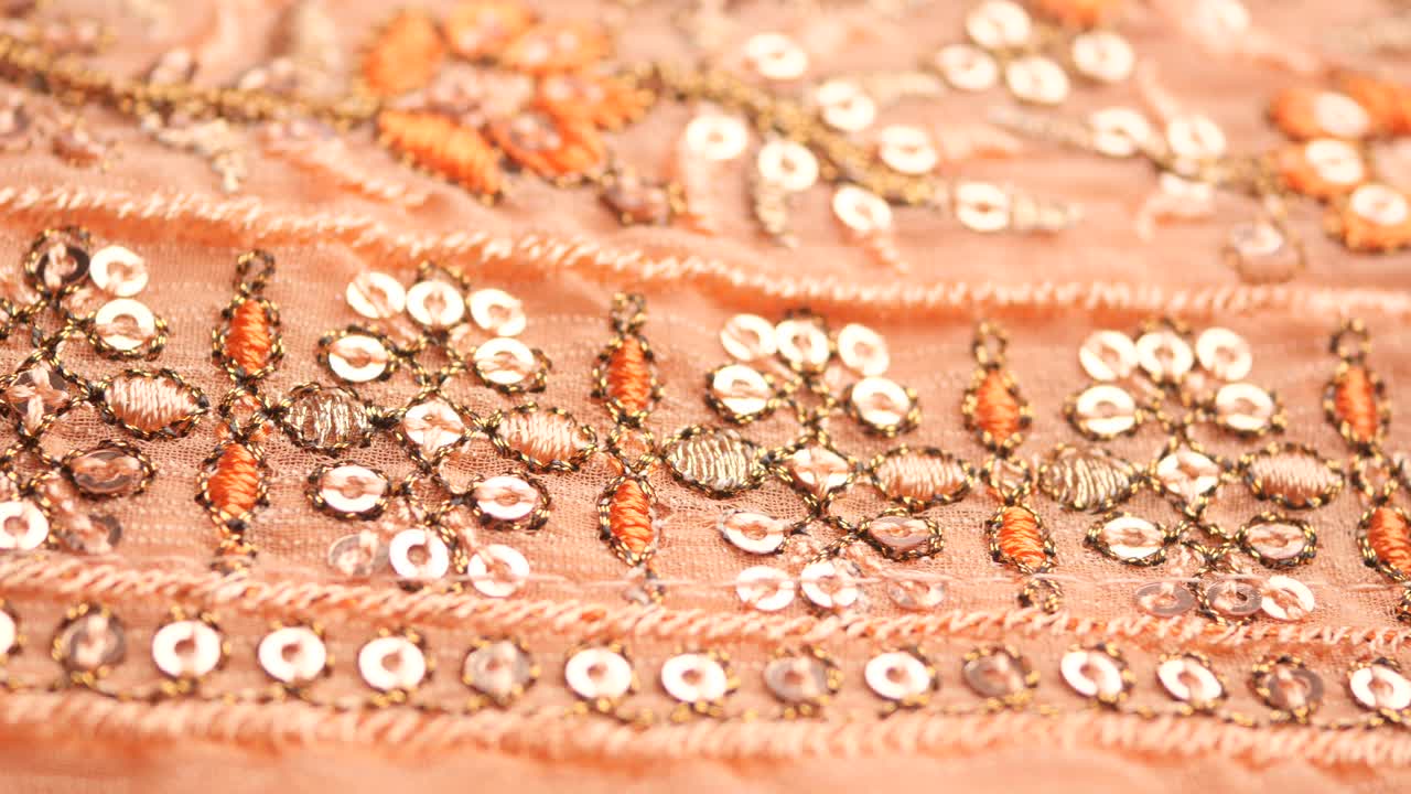 Close-up of Embroidered Peach Fabric with Sequins
