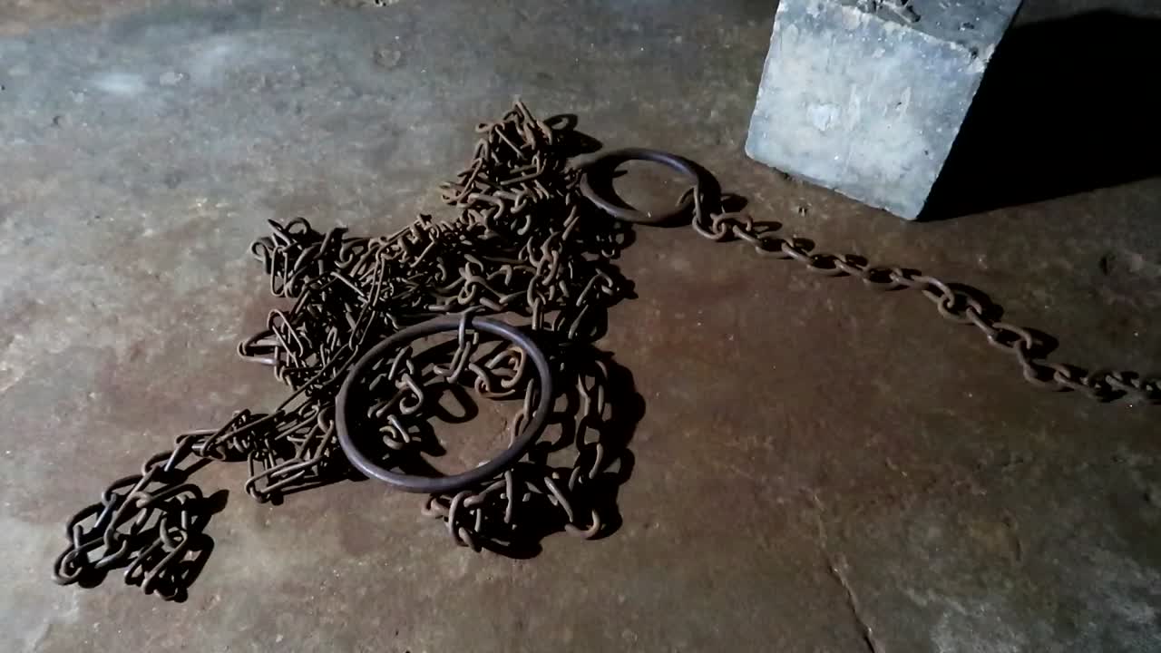 Chains on the floor in an african slave chamber of the Old Slave Market in Zanzibar