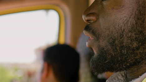 close up view of american ambulance driver talking by radio and receiving information from the hospital