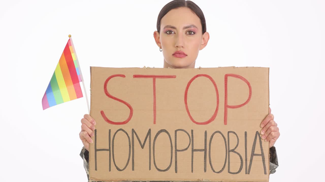 Woman Protesting Homophobia with Rainbow Pride Flag