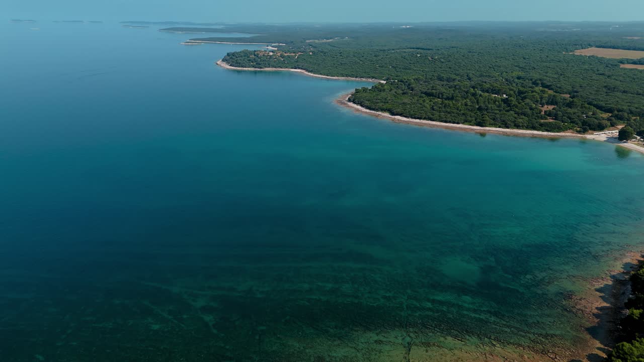 Brijuni National Park in Istria, Croatia near Pula. Coastline with clear blue sea and green trees