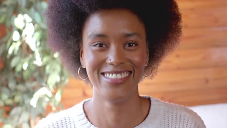 portrait of happy african american woman at home, in slow motion