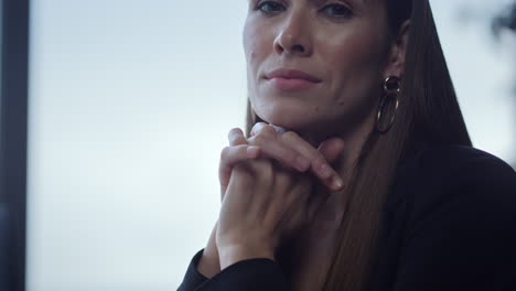 Businesswoman-sitting-at-remote-workplace.-Freelancer-looking-at-camera