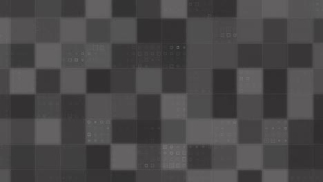 animation of grey squares of computer processor integrated circuit board on black background.