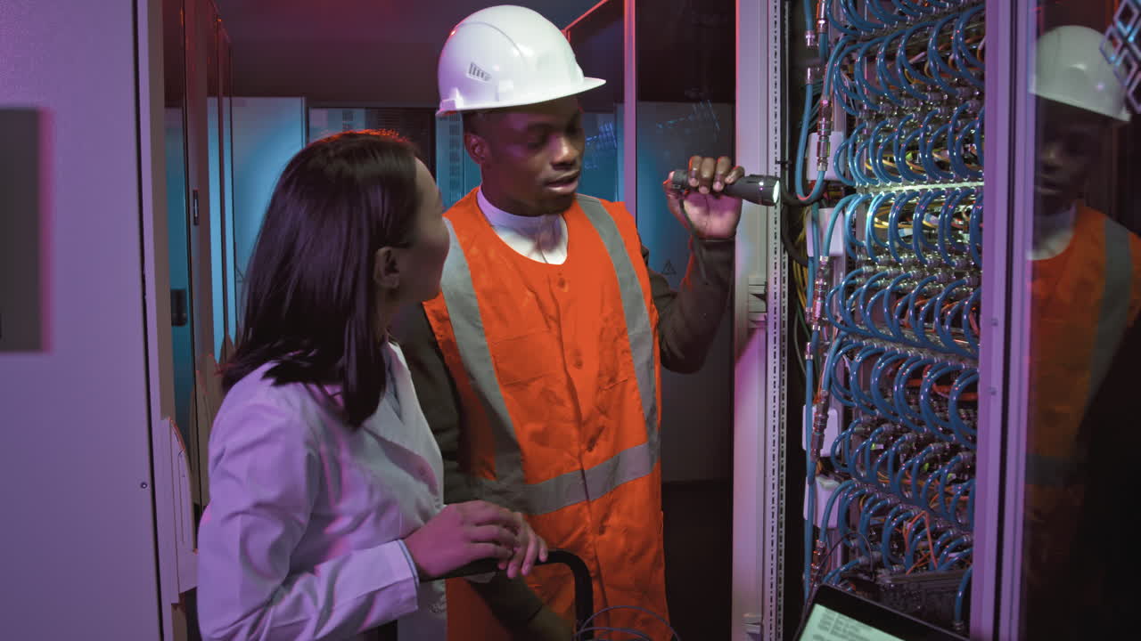 IT Specialist and Technician Checking Equipment in Data Center