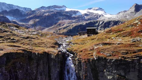 weisssee lake between the alpine mountains and the waterfall in high tauern national park in austria