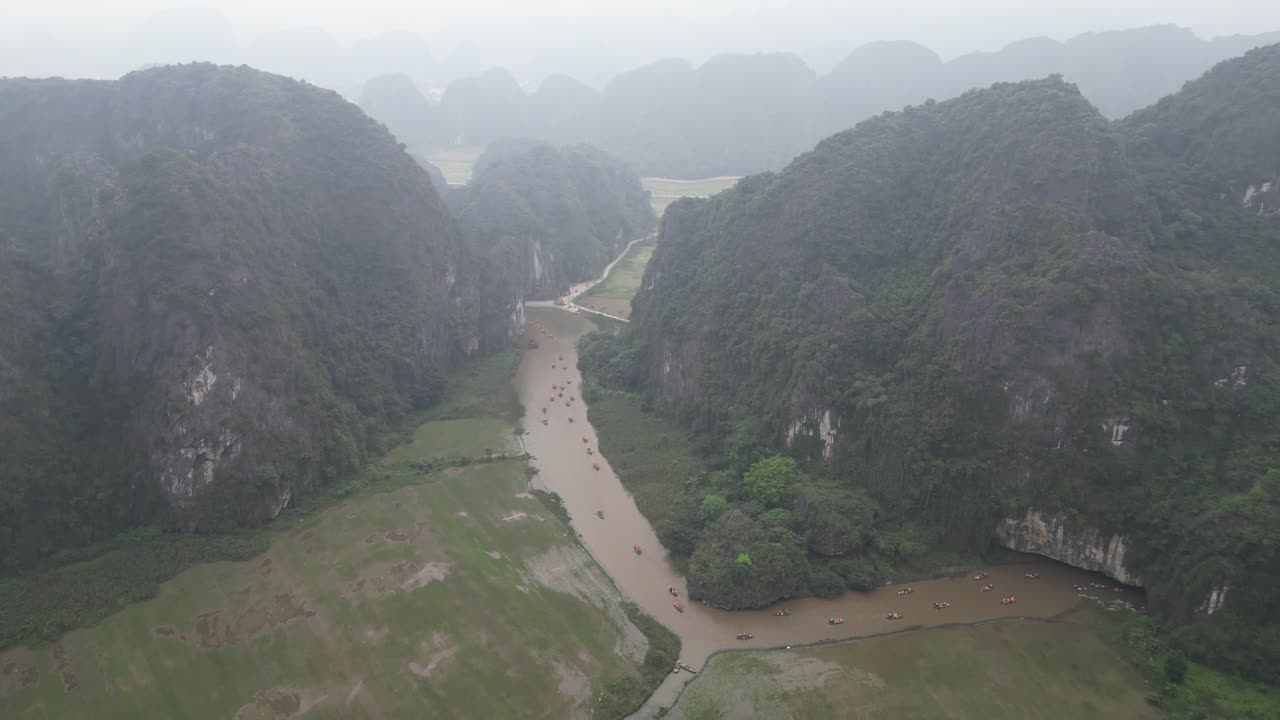aerial view of curving river through the cliffs in the mountainous region of Ninh Ninh in Northern Vietnam