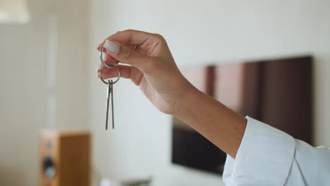 woman holding house keys