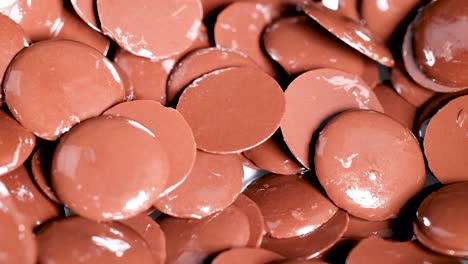 close-up view of chocolate discs moving