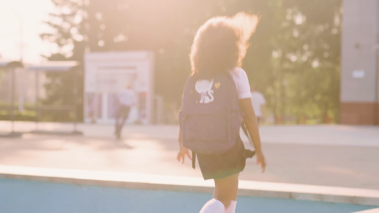 Schoolgirl Running in Park