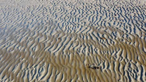 AERIAL---Lines-in-the-sand-on-the-Isle-of-Gigha,-Kintyre,-Scotland,-forward-shot