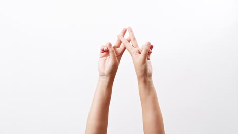 hand showing two thumbs up scissors victory chroma key isolated on a white studio background with copy space for place a text for advertisement.