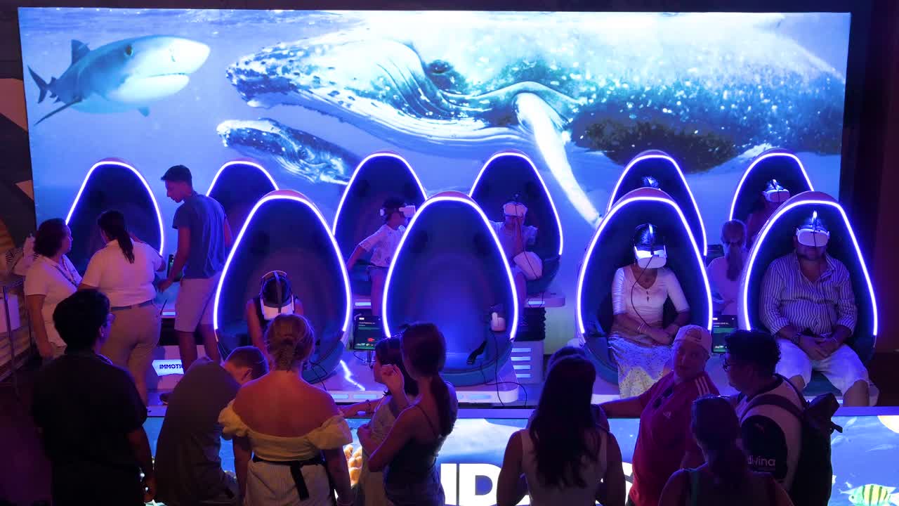 Visitors use Virtual Reality (VR) headsets at Oceanografic in the City of Arts and Sciences in Valencia, Spain. It is Europe’s largest oceanographic park, showcasing over 500 marine species.