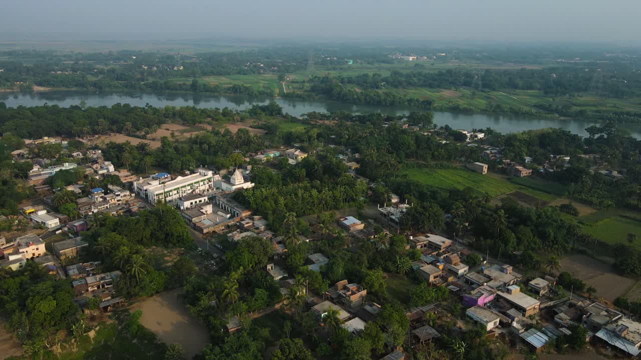 Sunrise aerial view of Murshidabad monuments, with soft light illuminating the palace and mosque.