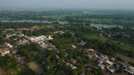 sunrise aerial view of murshidabad monuments, with soft light illuminating the palace and mosque.