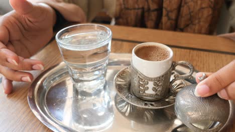 woman enjoying traditional turkish coffee