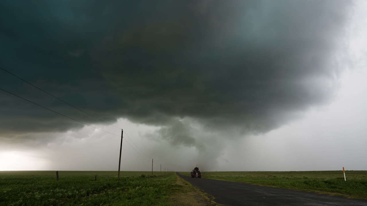 Armoured Storm Chasing Vehicle Drives Towards Developing Tornado