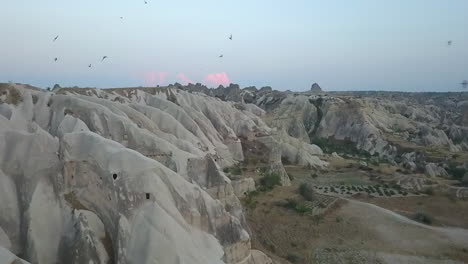 cliff swallows make their homes among eroded rock hoodoos in turkey