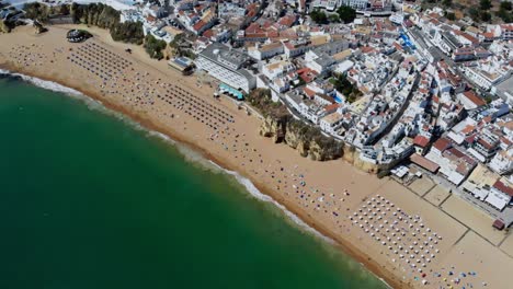 drone shot of the beach in albufeira, portugal