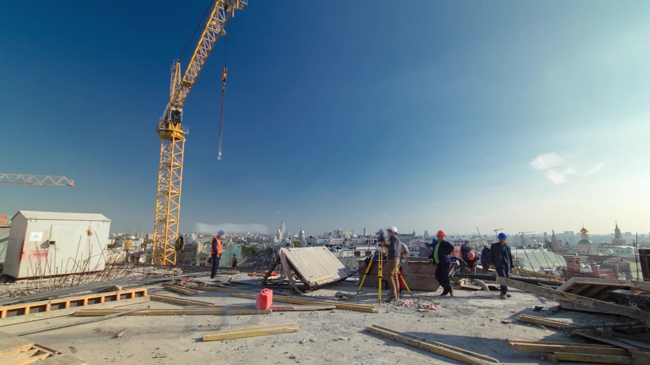 Steel bar rebar metal framework reinforcement for concrete at construction site panoramic timelapse. Crane works on a roof of new building in progress with many workers in uniform
