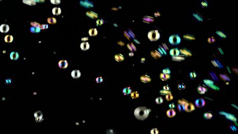 soap bubbles are flying fast black backgrounds bright and small soap bubbles fly fast black backgrounds