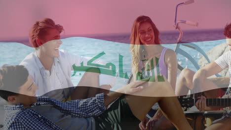 relajándose en la playa, amigos con la animación de la bandera iraquí en el fondo