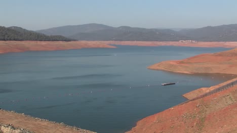 panorama pan shot of lake oroville half filled before oroville dam crisis in 2017, california, usa