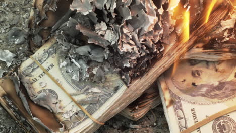 close up of prop money on fire