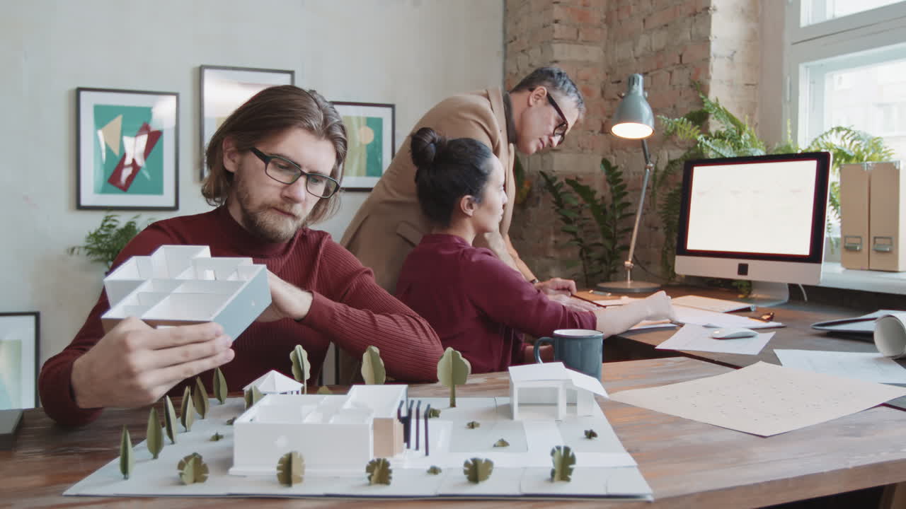 Architects Designing House Layout In Office