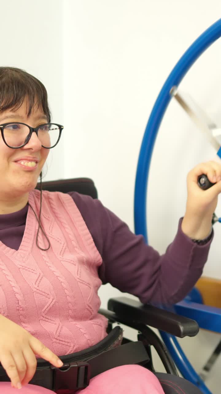 Happy Woman in Wheelchair Doing Arm Exercises on Rehabilitation Machine