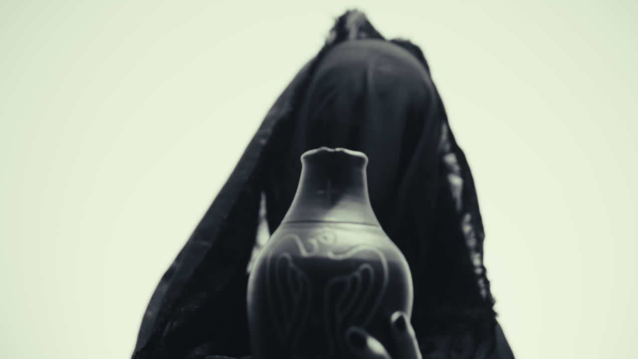 Woman Holding Ornate Clay Pot