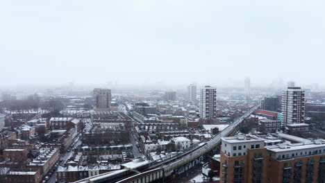 drone shot over heavy snow limehouse commercial road london