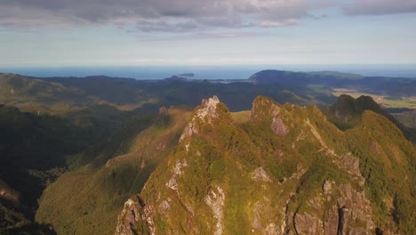 Panning-across-the-valley-between-two-mountain-peaks-looking-over-breathtaking-landscape