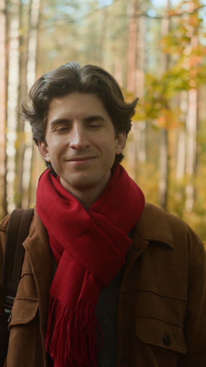 Man with Red Scarf in Autumn Forest