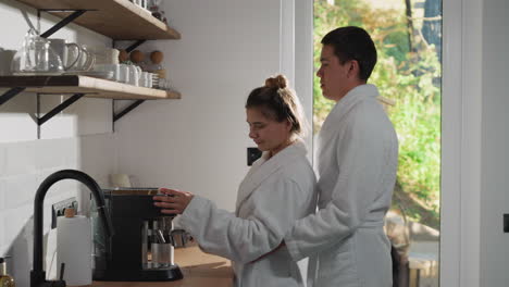 couple making coffee in the kitchen