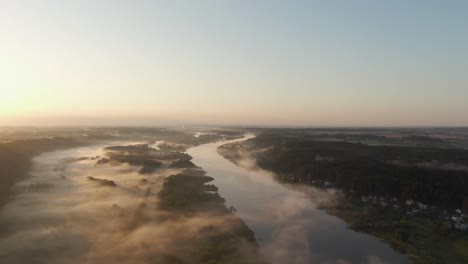 flying over river nemunas  with fog in the early morning near raudondvaris, lithuania