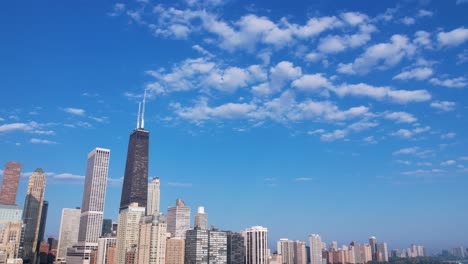 timelapse of city skyline with puffy clouds